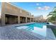 Stunning pool and patio area with a view of the home at 8853 Sherborne Gate Ave, Las Vegas, NV 89148