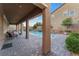 Relaxing backyard oasis with a sparkling pool and covered patio at 8853 Sherborne Gate Ave, Las Vegas, NV 89148