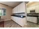 Wet bar with wine rack and granite countertop at 8853 Sherborne Gate Ave, Las Vegas, NV 89148