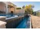 Stunning waterfall feature of the pool at 9316 Provence Garden Ln, Las Vegas, NV 89145