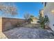 Landscaped backyard with brick patio and small lawn at 9462 Diamond Bridge Ave, Las Vegas, NV 89166