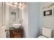 Elegant powder room with a pedestal sink and decorative accents at 9462 Diamond Bridge Ave, Las Vegas, NV 89166