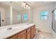 Shared bathroom with double sinks and a shower/tub combo at 9462 Diamond Bridge Ave, Las Vegas, NV 89166