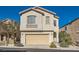 Two-story house with attached garage and landscaping at 9462 Diamond Bridge Ave, Las Vegas, NV 89166