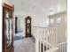 Upstairs hallway with grandfather clock and glass cabinet at 9462 Diamond Bridge Ave, Las Vegas, NV 89166