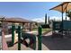 playground with play structures and shaded area at 9490 Alma Ridge Ave, Las Vegas, NV 89178