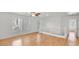 Spacious loft area with wood flooring and white walls at 9516 Walking Spirit Ct, Las Vegas, NV 89129