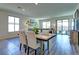 Light and airy dining room with wood table and chairs at 9577 Among Ln, Las Vegas, NV 89143