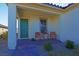 Cozy front porch with seating and a beautifully patterned window accent at 9577 Among Ln, Las Vegas, NV 89143