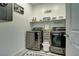 Laundry room with washer, dryer, and additional shelving at 9577 Among Ln, Las Vegas, NV 89143