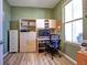 Home office with built-in shelving and a large window at 9577 Among Ln, Las Vegas, NV 89143