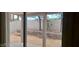 View of a small, landscaped backyard from inside at , Las Vegas, NV 89183