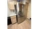 Stainless steel refrigerator in a light wood kitchen at 10065 Hemet Dr, Las Vegas, NV 89134