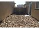 Small backyard with gravel and a patio at 1023 Desert Dome Ave, North Las Vegas, NV 89086