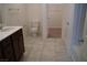 Bathroom with dark wood vanity and tiled floor at 1023 Desert Dome Ave, North Las Vegas, NV 89086