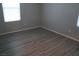 Bright bedroom with neutral walls and wood-look flooring at 1023 Desert Dome Ave, North Las Vegas, NV 89086