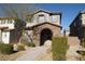 Two-story house with stone accents and a welcoming front porch at 1023 Desert Dome Ave, North Las Vegas, NV 89086