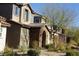 Two-story house with stone accents and a welcoming front porch at 1023 Desert Dome Ave, North Las Vegas, NV 89086