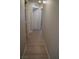 Light hallway with wood-look floors and access to bedrooms at 1023 Desert Dome Ave, North Las Vegas, NV 89086