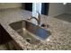 Kitchen sink with granite countertop and stainless steel faucet at 1023 Desert Dome Ave, North Las Vegas, NV 89086