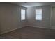 Living room with wood-look flooring and neutral wall colors at 1023 Desert Dome Ave, North Las Vegas, NV 89086