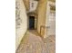 Inviting entryway with a dark-stained door and brick accents at 10328 Planter Box St, Las Vegas, NV 89178