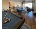 Open floor plan showcasing a game room, living area, and kitchen at 10328 Planter Box St, Las Vegas, NV 89178