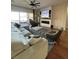 Bright living room featuring hardwood floors, a fireplace, and sliding doors to the backyard at 10328 Planter Box St, Las Vegas, NV 89178