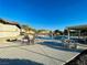 Community pool with lounge chairs and tables at 10328 Planter Box St, Las Vegas, NV 89178