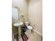 Clean and simple powder room with pedestal sink and toilet at 10328 Planter Box St, Las Vegas, NV 89178