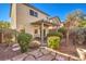 Relaxing backyard with covered patio, stone pathway, and landscaping at 10546 Hartford Hills Ave, Las Vegas, NV 89166