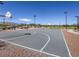 Outdoor basketball court with lights and well-maintained surface at 10546 Hartford Hills Ave, Las Vegas, NV 89166