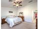 Main bedroom with ceiling fan and carpeted floor at 10546 Hartford Hills Ave, Las Vegas, NV 89166