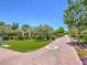 Brick pathway with lush landscaping and a grassy area at 10546 Hartford Hills Ave, Las Vegas, NV 89166