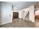 Bright entryway with tile floors and staircase leading upstairs at 10546 Hartford Hills Ave, Las Vegas, NV 89166