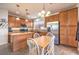 Eat-in kitchen with stainless steel appliances and an island at 10546 Hartford Hills Ave, Las Vegas, NV 89166