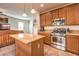 Modern kitchen with stainless steel appliances and island at 10546 Hartford Hills Ave, Las Vegas, NV 89166