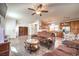 Living room features a ceiling fan and open floor plan at 10546 Hartford Hills Ave, Las Vegas, NV 89166