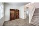 Staircase with wood railing and built-in shelving at 10546 Hartford Hills Ave, Las Vegas, NV 89166