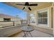 Private balcony with ceiling fan and small table, offering an outdoor space at 10809 Garden Mist Dr Dr # 2041, Las Vegas, NV 89135