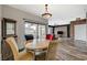 Cozy dining area with round table and four chairs, adjacent to living room at 10809 Garden Mist Dr Dr # 2041, Las Vegas, NV 89135