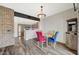 Dining area with wood floors and view into the kitchen at 10809 Garden Mist Dr Dr # 2041, Las Vegas, NV 89135