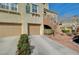 Attached garage with two garage doors and additional parking space at 10809 Garden Mist Dr Dr # 2041, Las Vegas, NV 89135