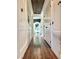 Long hallway with wood flooring, recessed lighting, and white walls at 10809 Garden Mist Dr Dr # 2041, Las Vegas, NV 89135