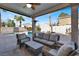 Covered patio with seating area overlooking the pool and spa at 1138 Aspen Valley Ave, Las Vegas, NV 89123