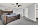 Primary bedroom with large bed, ceiling fan, and grey walls at 1138 Aspen Valley Ave, Las Vegas, NV 89123