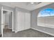 Bedroom with double door closet and arched window at 1138 Aspen Valley Ave, Las Vegas, NV 89123