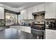 Modern kitchen with stainless steel appliances and a mosaic backsplash at 1138 Aspen Valley Ave, Las Vegas, NV 89123