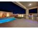 Night view of backyard with pool, spa, and outdoor kitchen at 11870 Star Grass Ave, Las Vegas, NV 89138