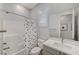 Clean bathroom with shower/tub combo and polka dot curtain at 11870 Star Grass Ave, Las Vegas, NV 89138